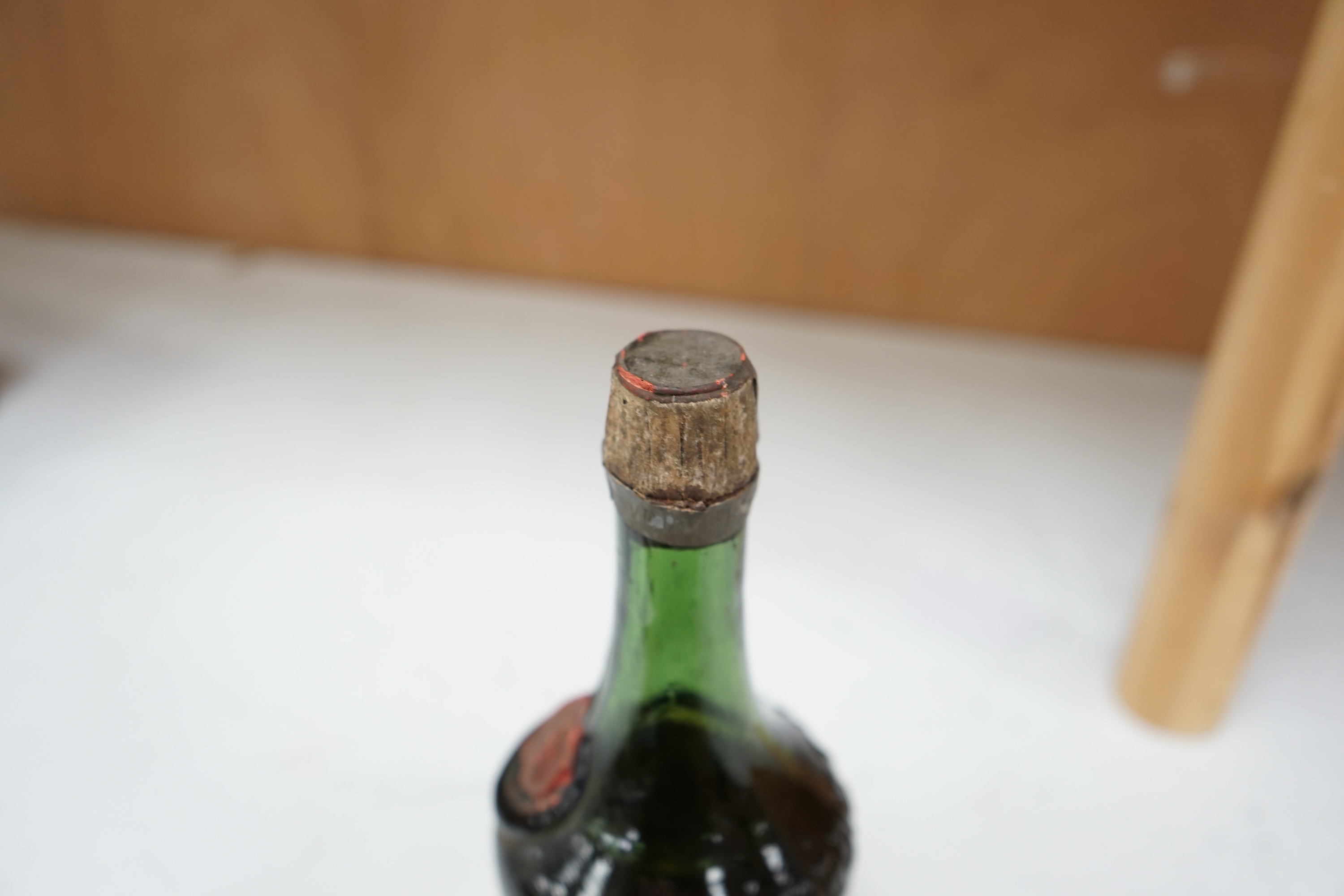 A bottle of Benedictine. Condition fair to good, label missing.